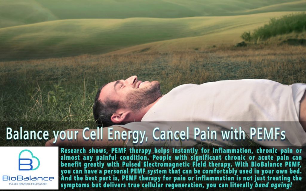 Man laying and smiling in field with text below stating "Balance your Cell Energy, Cancel Pain with PEMFs"